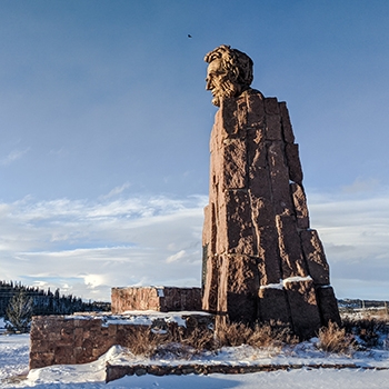 The Abraham Lincoln sculpture in Laramie is undefined except for Lincoln’s head, which can be clearly seen. The remainder of the sculpture appears to be large pieces of rock pieced together to create a solid block that reaches toward the sky.