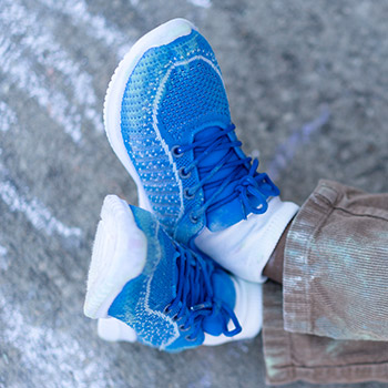 Close-up of a pair of blue Operation Warm sneakers