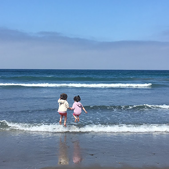 Two children in the waves at Patrick’s Point State Park