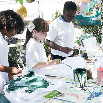 children painting at the green project