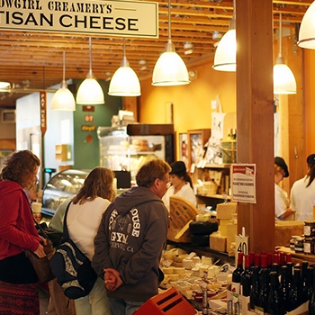 Customers browsing artisan cheese products at Cowgirl Creamery.