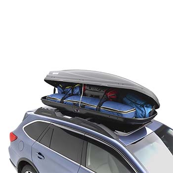 A Thule Cargo Carrier, Extended version, is attached to the rooftop of a Subaru. It is open and packed with several bags showing how much it can hold when full.