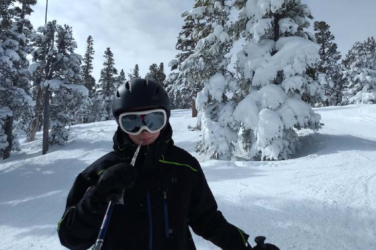 Gordiyenko’s son munching on an icicle