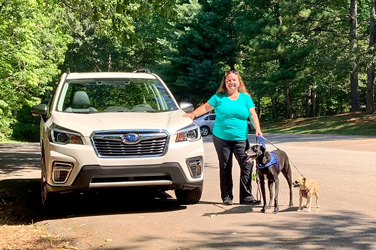 Melissa Halliburton with her 2020 Forester and pups, Ace and Roxy.