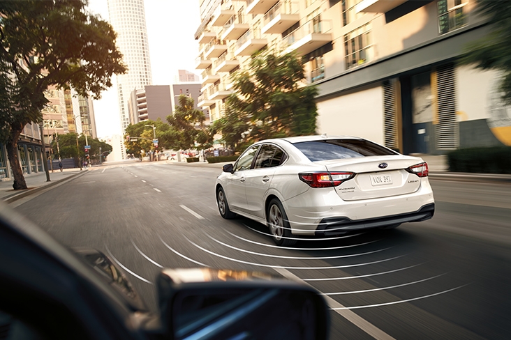 2021 Subaru Legacy using Blind-Spot Detection on a city street.