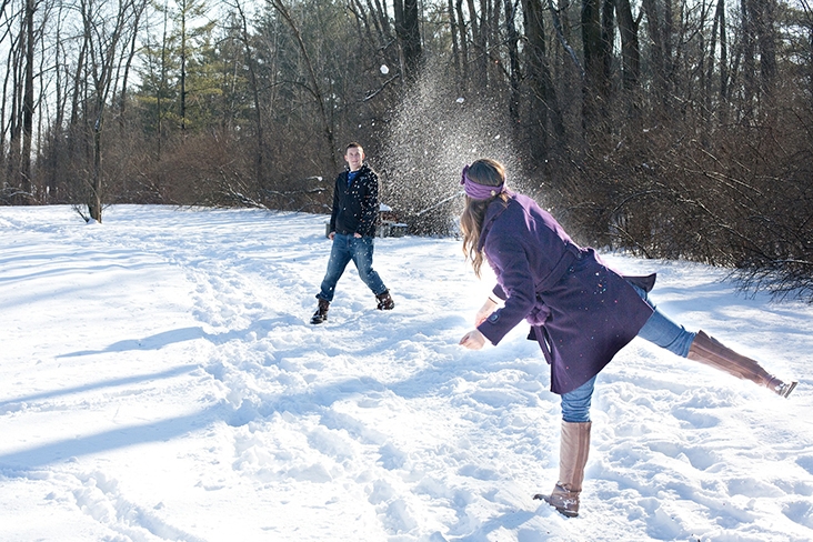 Couple having a snowball fight