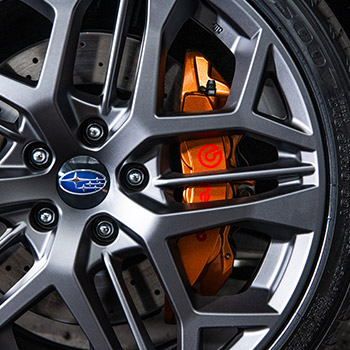 Close-up of 2025 Subaru WRX tS wheel and calipers in signature gold color