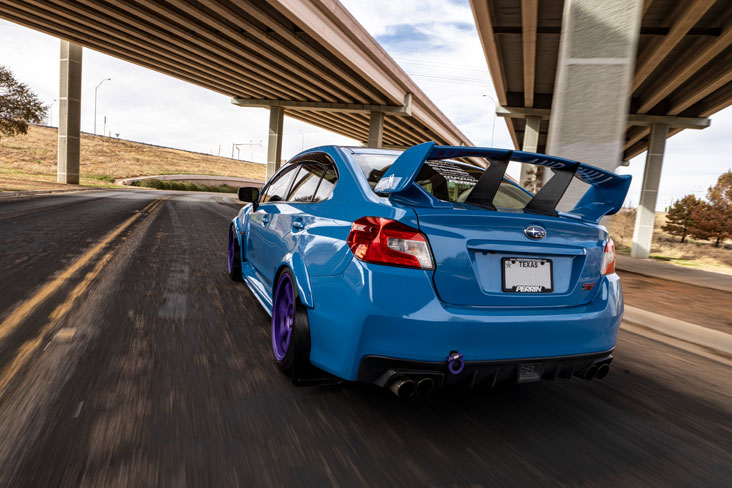 2016 Subaru WRX STI Series.HyperBlue driving under bridge