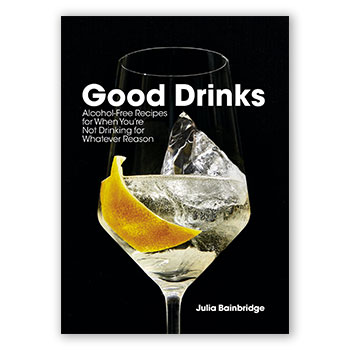 Julia Bainbridge’s book cover showing a black background with a backlit wine glass. The glass is filled with a bubbly drink and has a lemon peel on the glass rim.