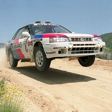 Chad DiMarco leaps over a jump in the 1992 Rim of the World Rally.