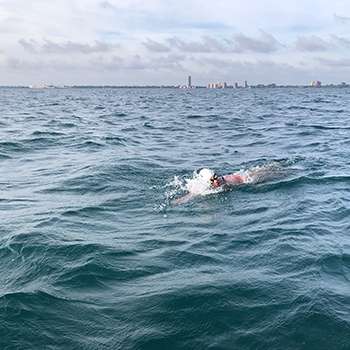 Elizabeth Fry swimming in the blue ocean waters.