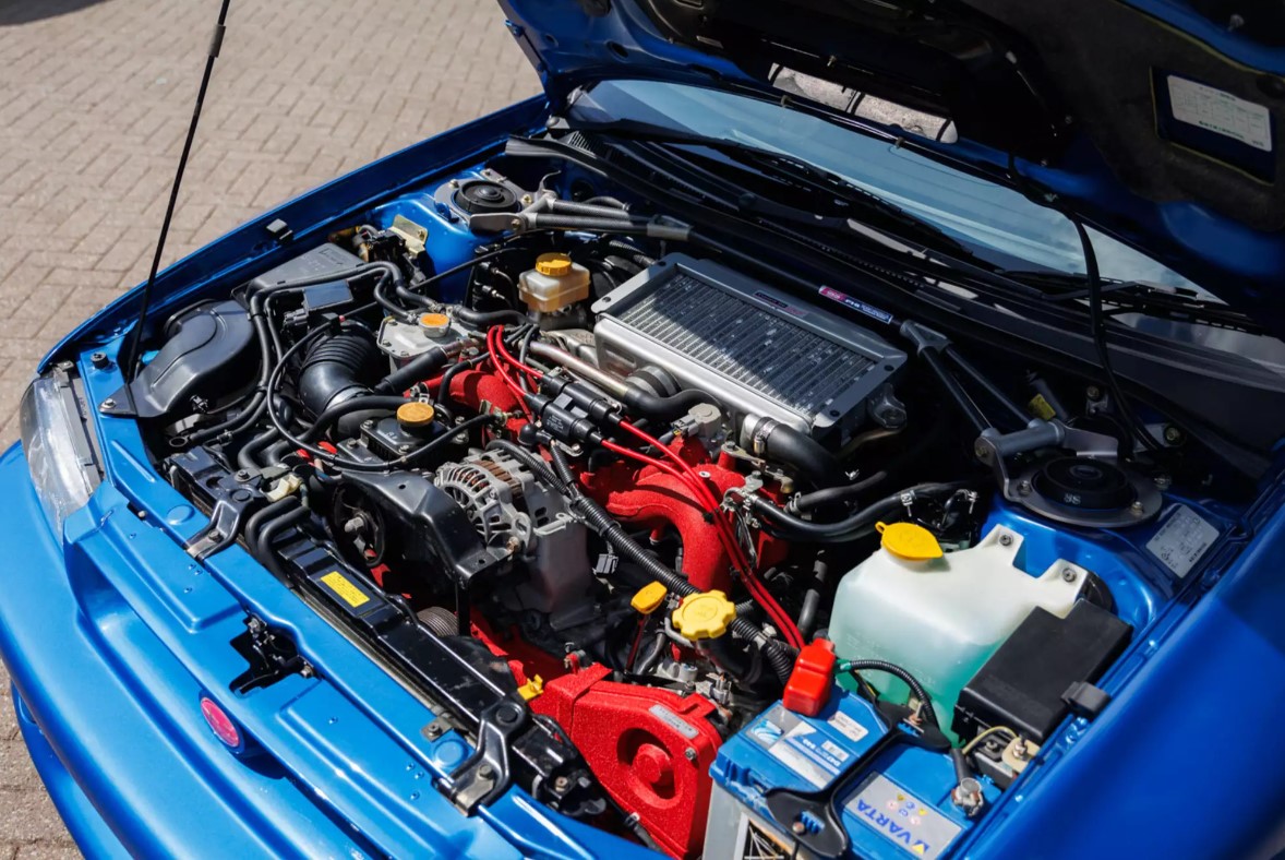 A close-up shot of the engine of the 1998 Subaru Impreza 22B STi