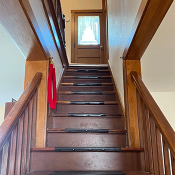 Picture of a wooden stairway inside the Field of Dreams movie site house