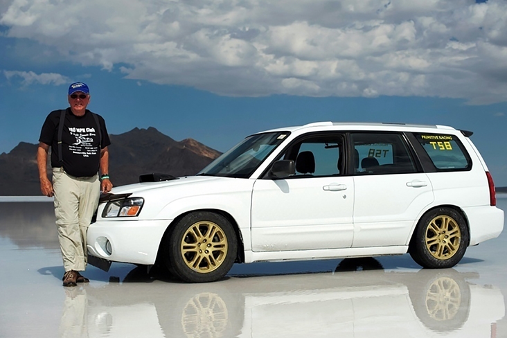 Bill Long stands beside his 2005 5-speed turbocharged Forester at the Utah Salt Flats Racing Association’s competition in 2012