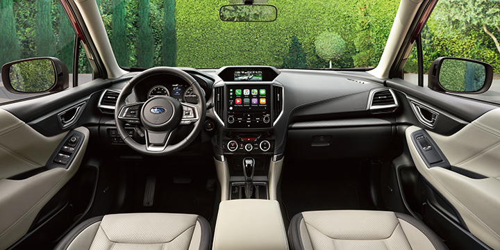 The interior is defined by high-quality, soft-touch materials.