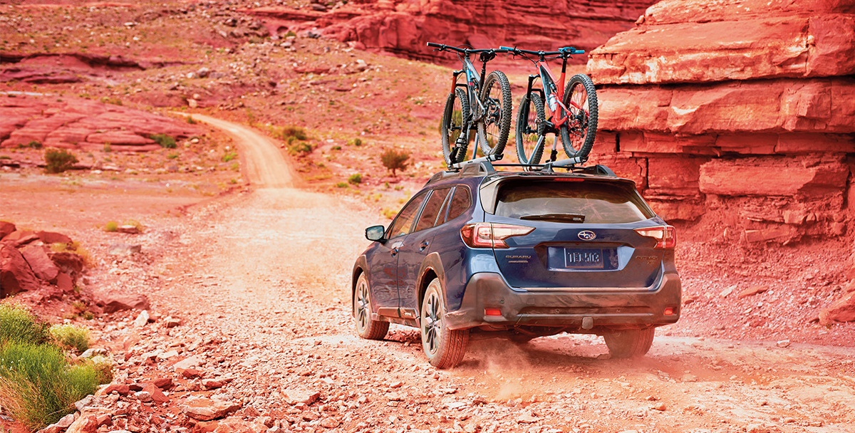 Subaru Forester featuring a hitch-mounted bike rack with two bikes