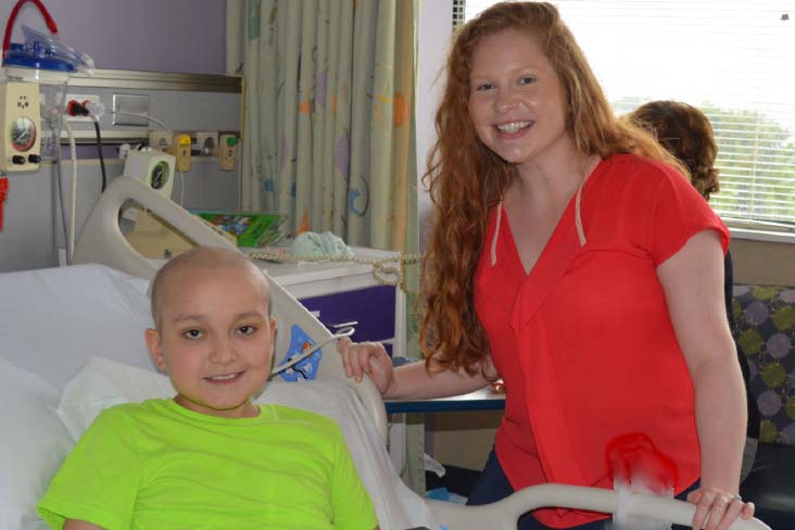 Caitlin Cottrell with cancer patient at hospital