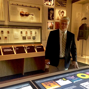 Darden standing next to a display case at the Smithsonian National Museum of African American History and Culture.