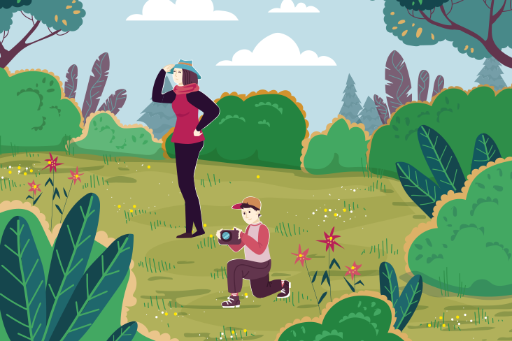 An illustration of what appears to be a mother with her son in a wilderness setting. The mother has her hand to her hat and is looking in the distance. Her son is on his knee taking a photograph.