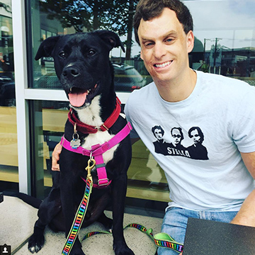 Winston and Dave sit outside a local pizza restaurant as a happy family.