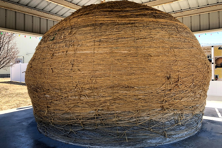 The World’s Largest Ball of Twine in Cawker City, Kansas, is yellow in color and stretches 45 feet across.