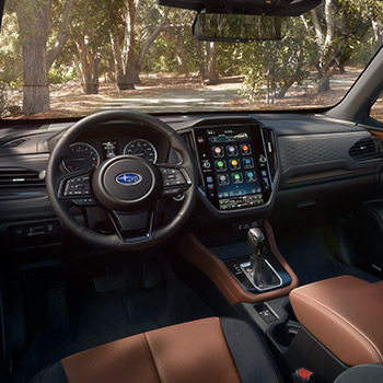 The  interior front seats and dashboard of a 2025 Subaru Forester