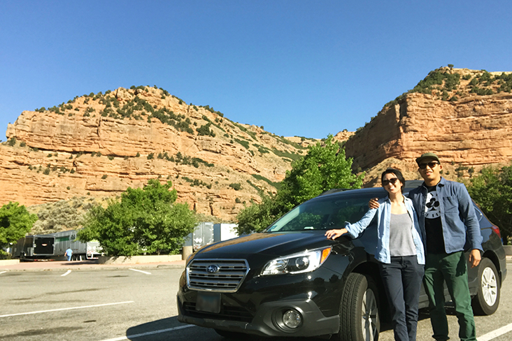 Kwon and Flores pose with their Outback in Utah during one of their culinary road trips.