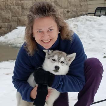 Cheryne Standart with her pup, Amani, in the snow