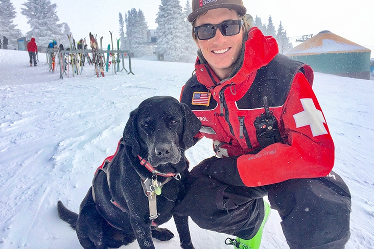 Drew and his black lab, Mookie.