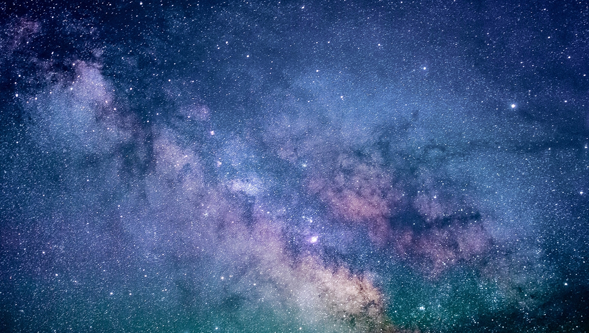 An image of the night sky showing countless stars and galaxies