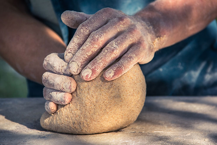 Hands kneading bread