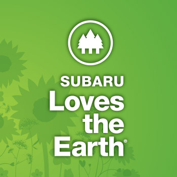 Subaru Loves the Earth logo. The background is green with illustrations of sunflowers, and it says Subaru Loves the Earth. At the top is a circle with an illustration of three evergreen trees in white.