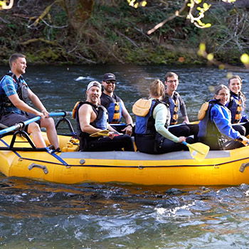 A group whitewater rafting