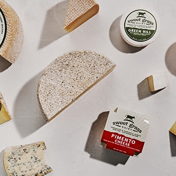 Sweetgrass cheeses in their individual packages viewed from above.