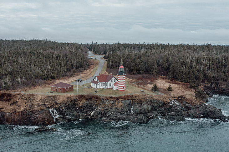A drone view of the West Quoddy Head Lighthouse on the coast of Lubec, Maine