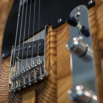 close up of guitar made of salvaged wood