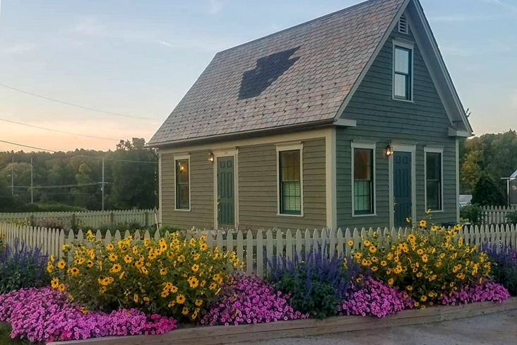 house with flowers out front