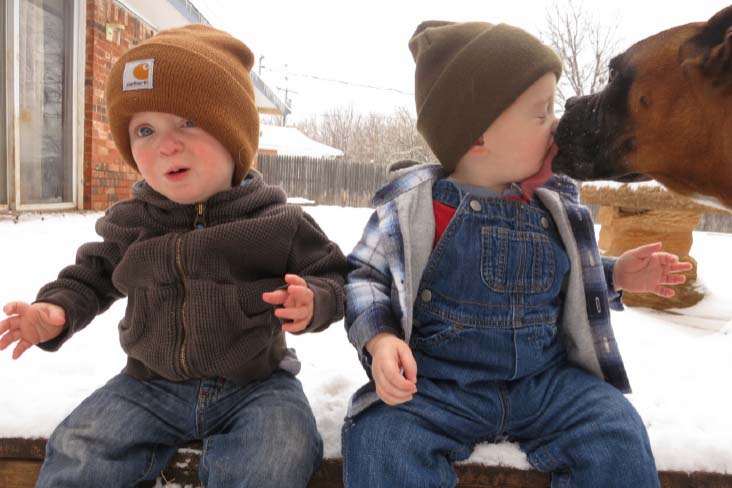 Twins outside in snow with Rando