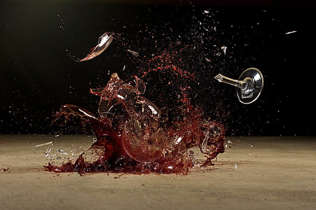 Wine,Glass,Exploding,On,Concrete
