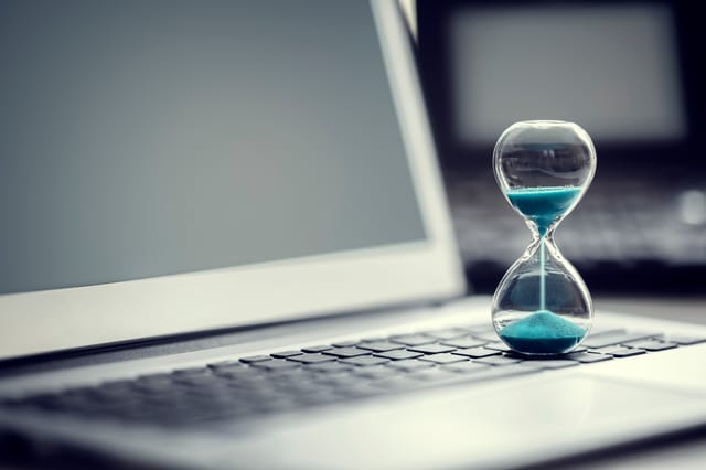 hourglass on laptop hourglass on laptop