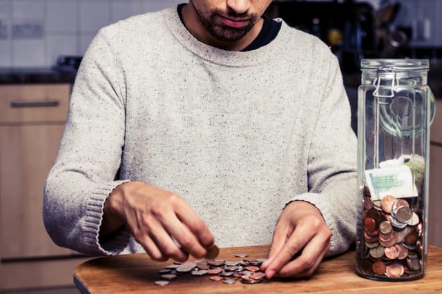 person counting coins person counting coins