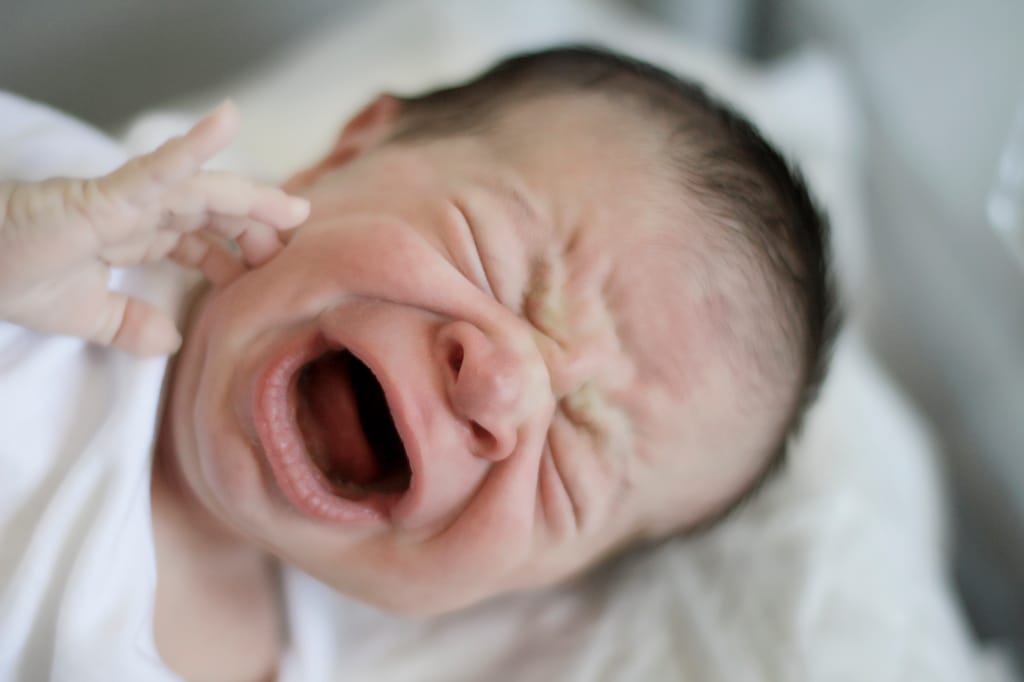 Photo of crying baby Photo of crying baby