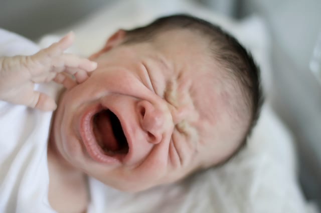 Photo of crying baby Photo of crying baby
