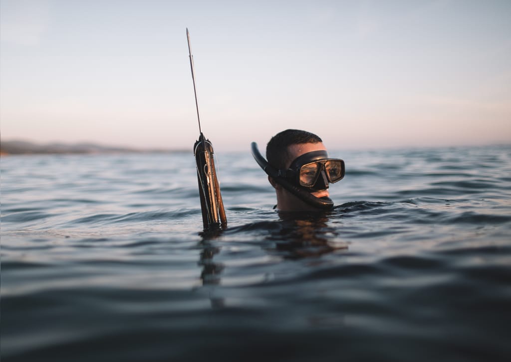 Spearfisherman Submerged Up To His Head Spearfisherman Submerged Up To His Head