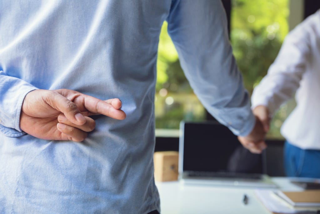 Trickery,Concept.business,Partners,Shaking,Hands,With,One,Of,Them,Holding Trickery,Concept.business,Partners,Shaking,Hands,With,One,Of,Them,Holding