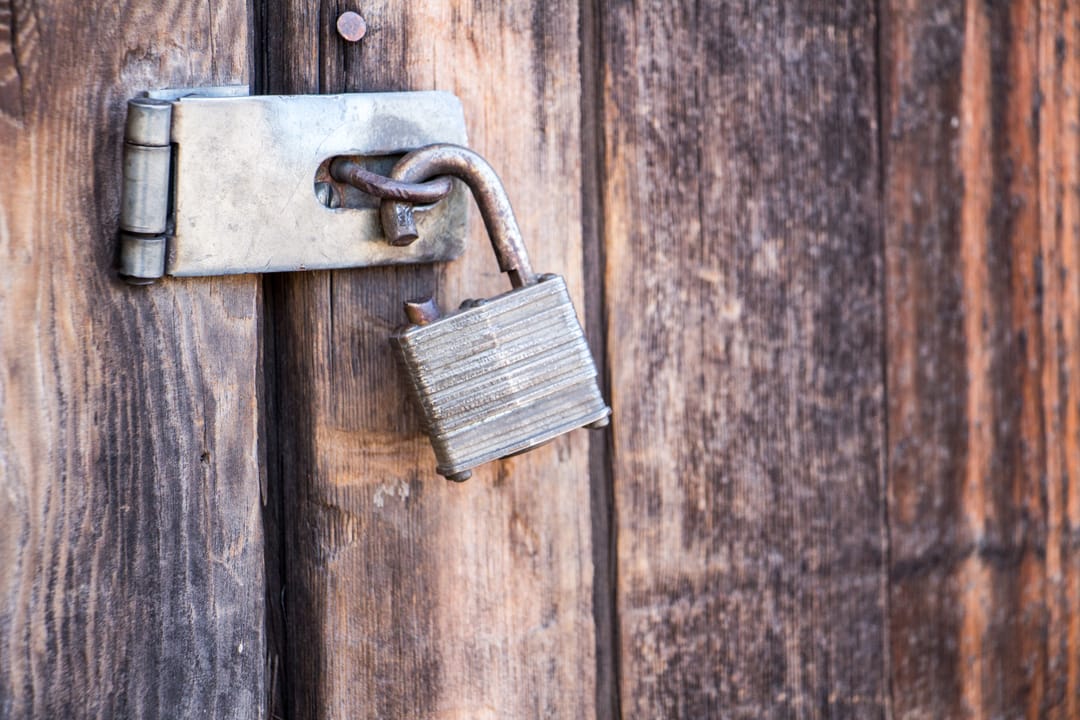 Broken,Lock,On,A,Wooden,Door