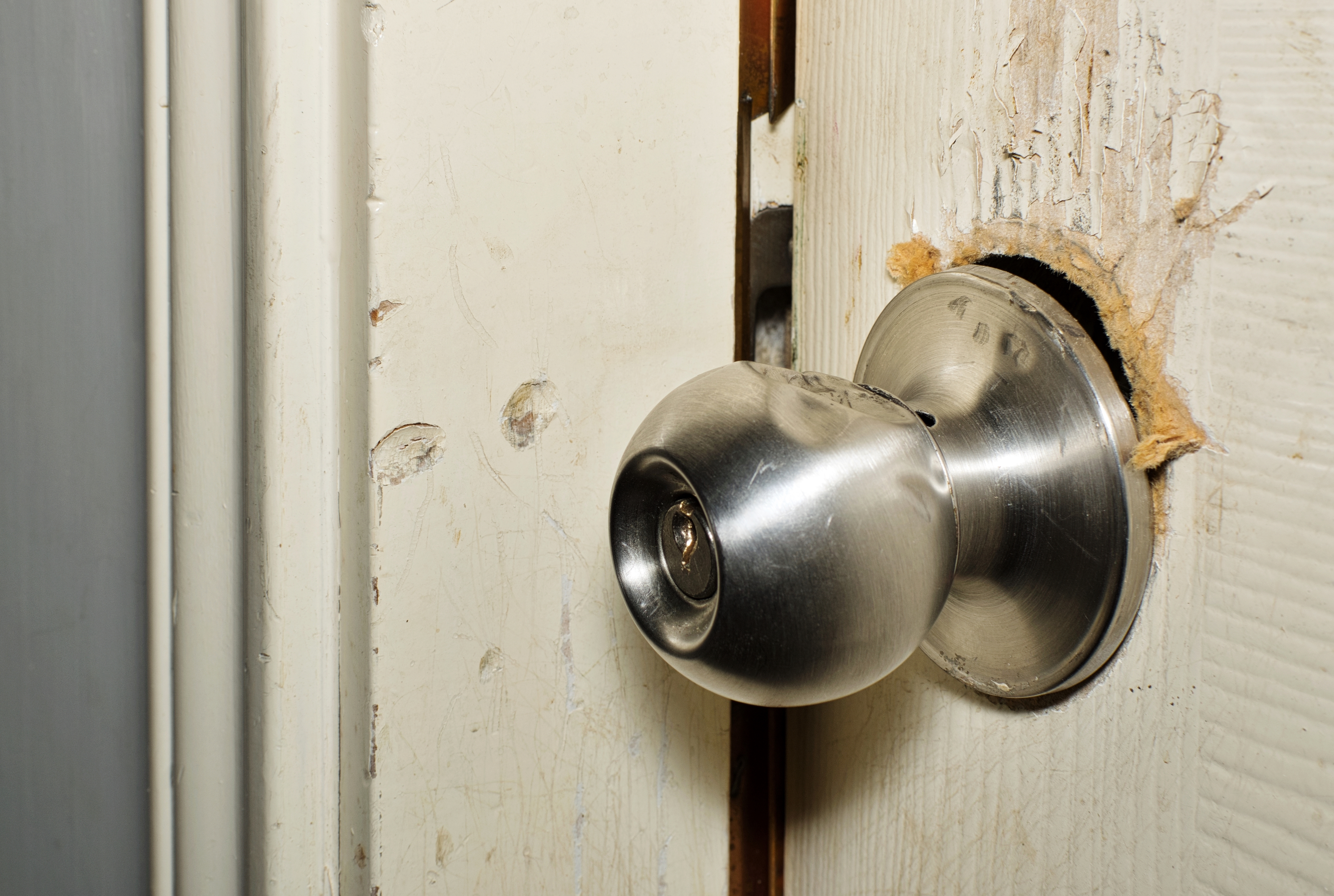 Broken,Modern,Doorknob,Closeup,With,Signs,Of,Forced,Entry,,Criminal