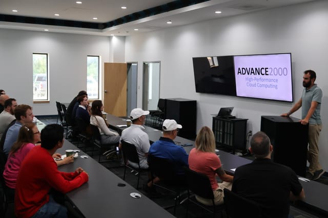 Employees at Advance2000's office in New York. Employees at Advance2000's office in New York.