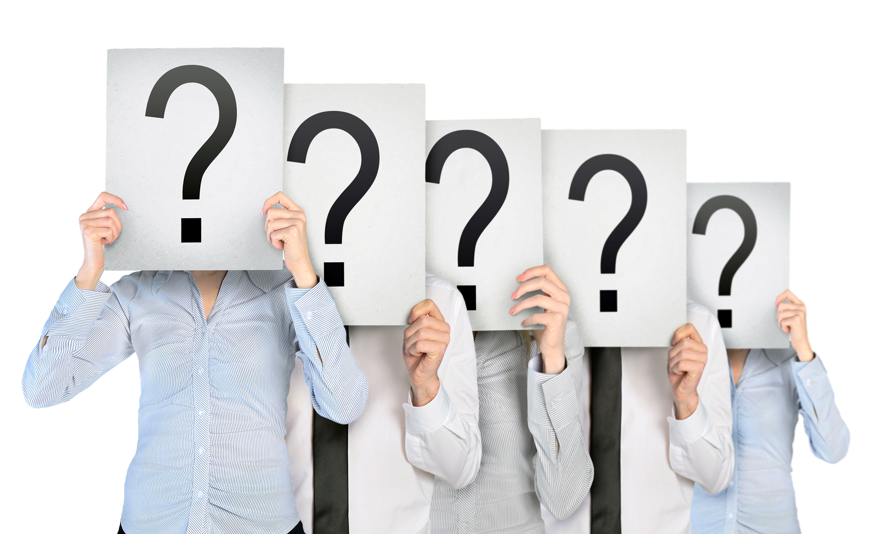 people holding up signs with a question mark on them