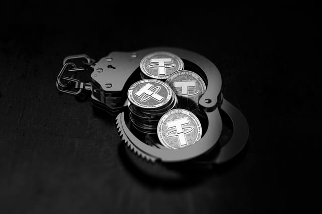 Tether coins in handcuffs Tether coins in handcuffs